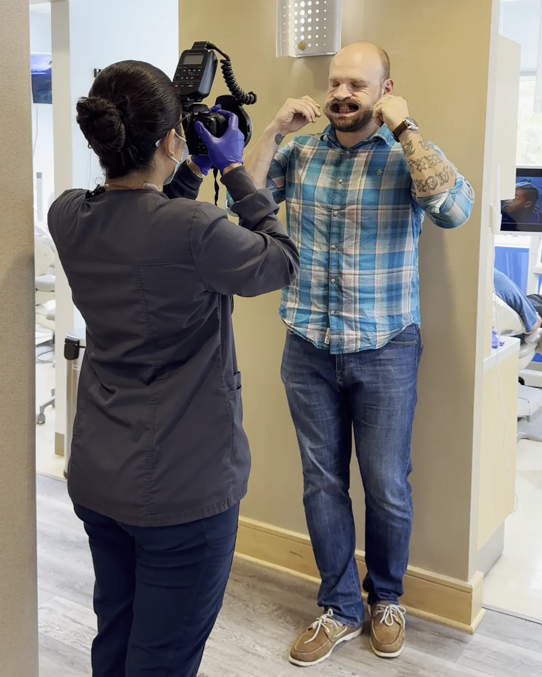 A Westlake team member photographing a guest's teeth during the records visit
